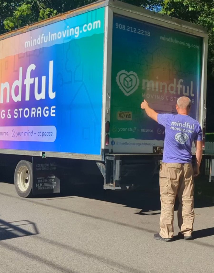 moving-truck Mindful moving truck and a team member.